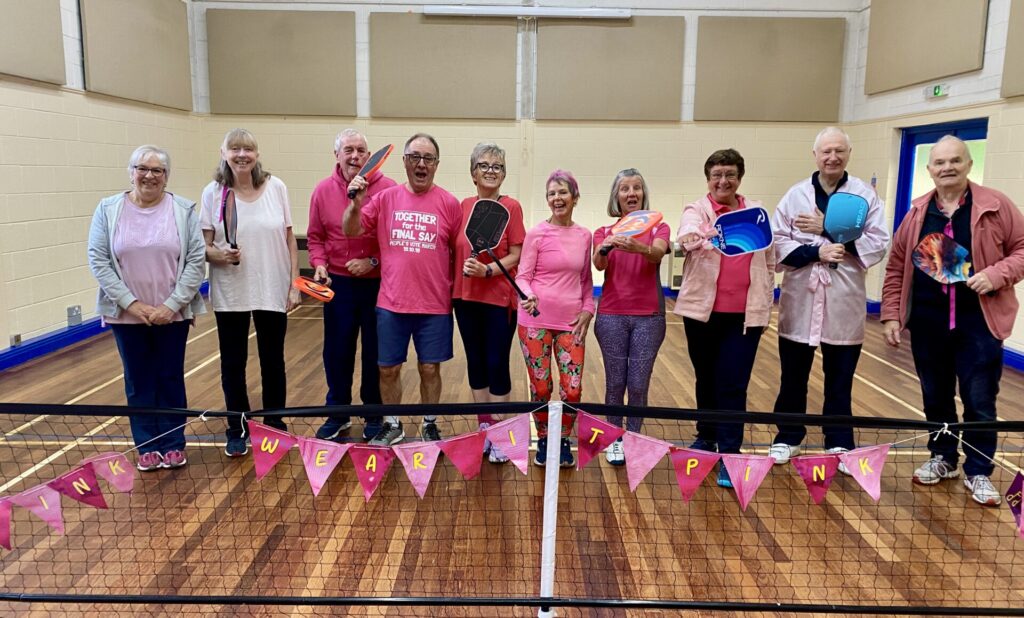 Pickle ball players dressed up in pink for charity in Breast Awareness week