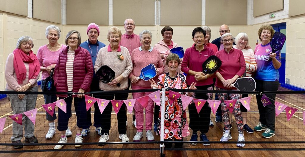 Pickle ball players dressed up in pink for charity in Breast Awareness week