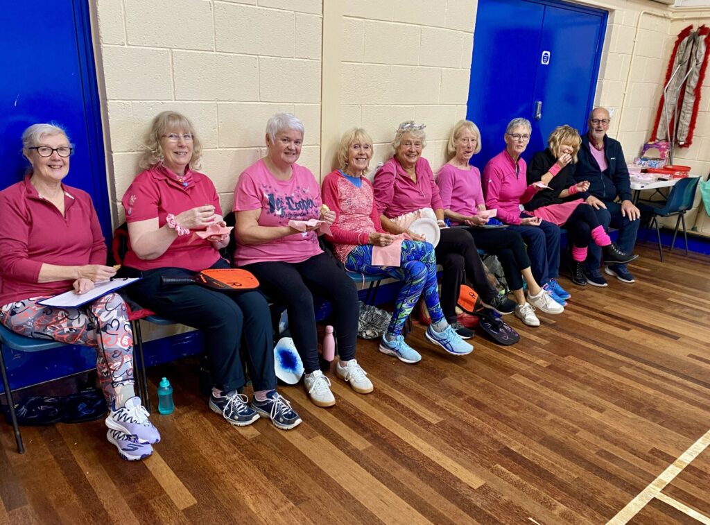 Pickle ball players dressed up in pink for charity in Breast Awareness week
