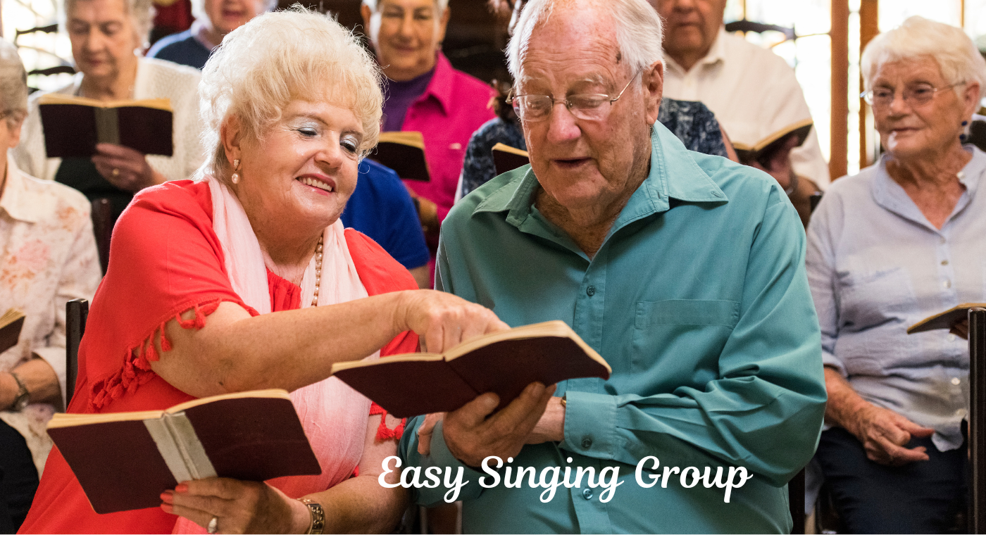 Image shows a man and a woman as part of a group of singers